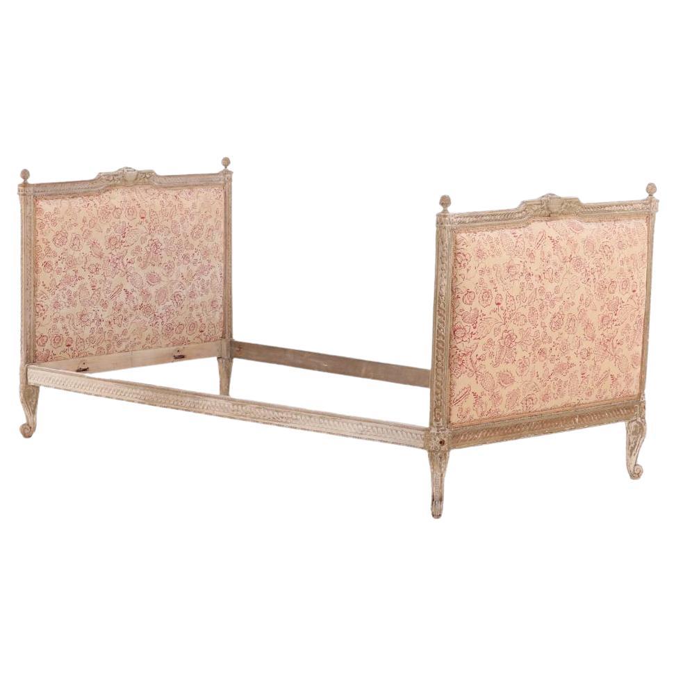 A French Louis XV style carved and painted daybed C 1900.