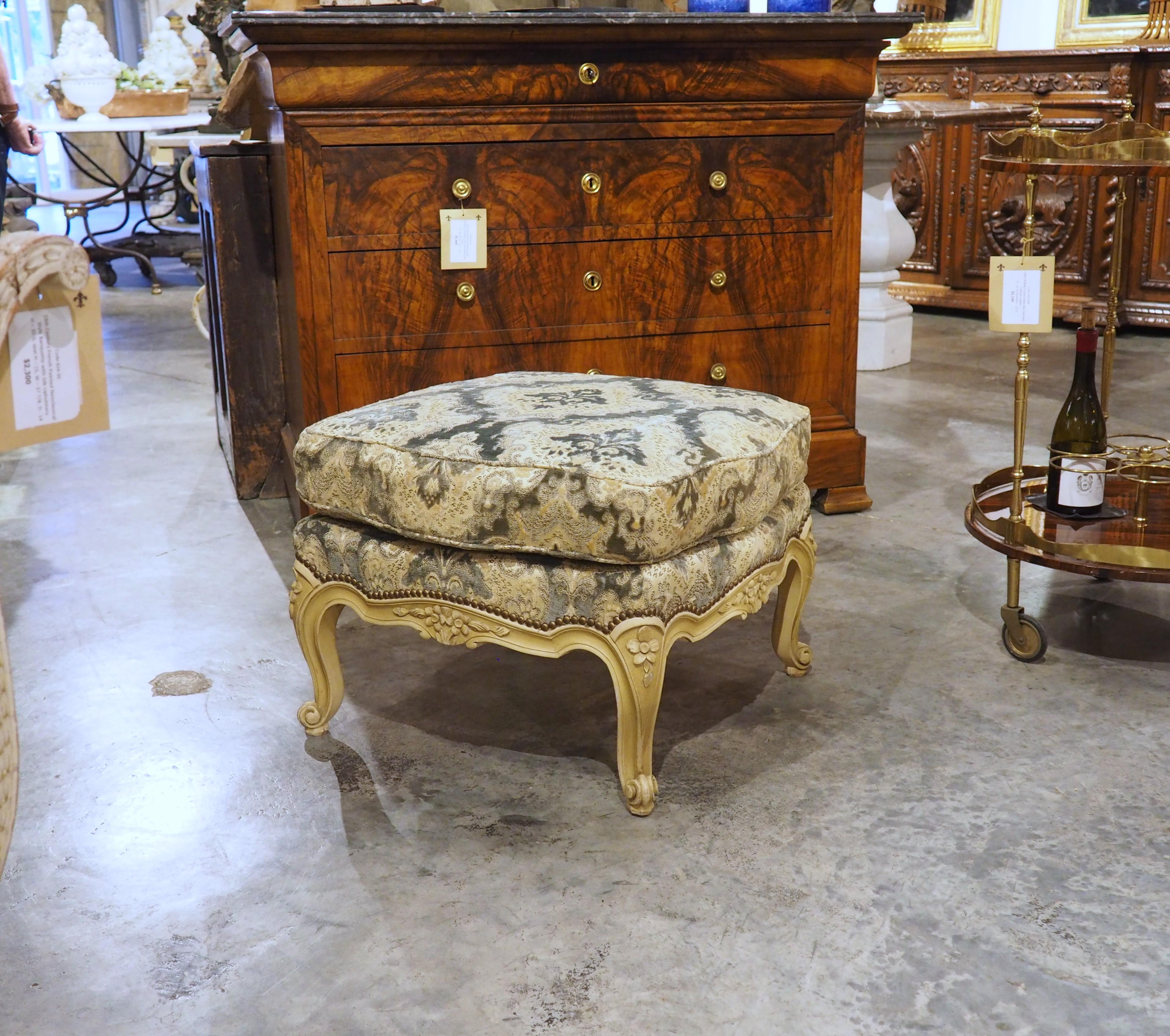 More information coming soon…

A beautiful tabouret, hand-carved in the style of Louis XV, with a creme painted finish and two cushions of blue, gold, and cream.  The tabouret, which dates to the 1950s, has subtle bombe curves on each side, which