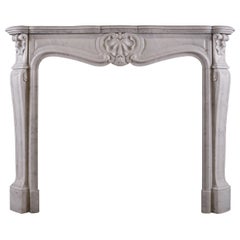 A French Louis XV style Fireplace In Italian Carrara Marble