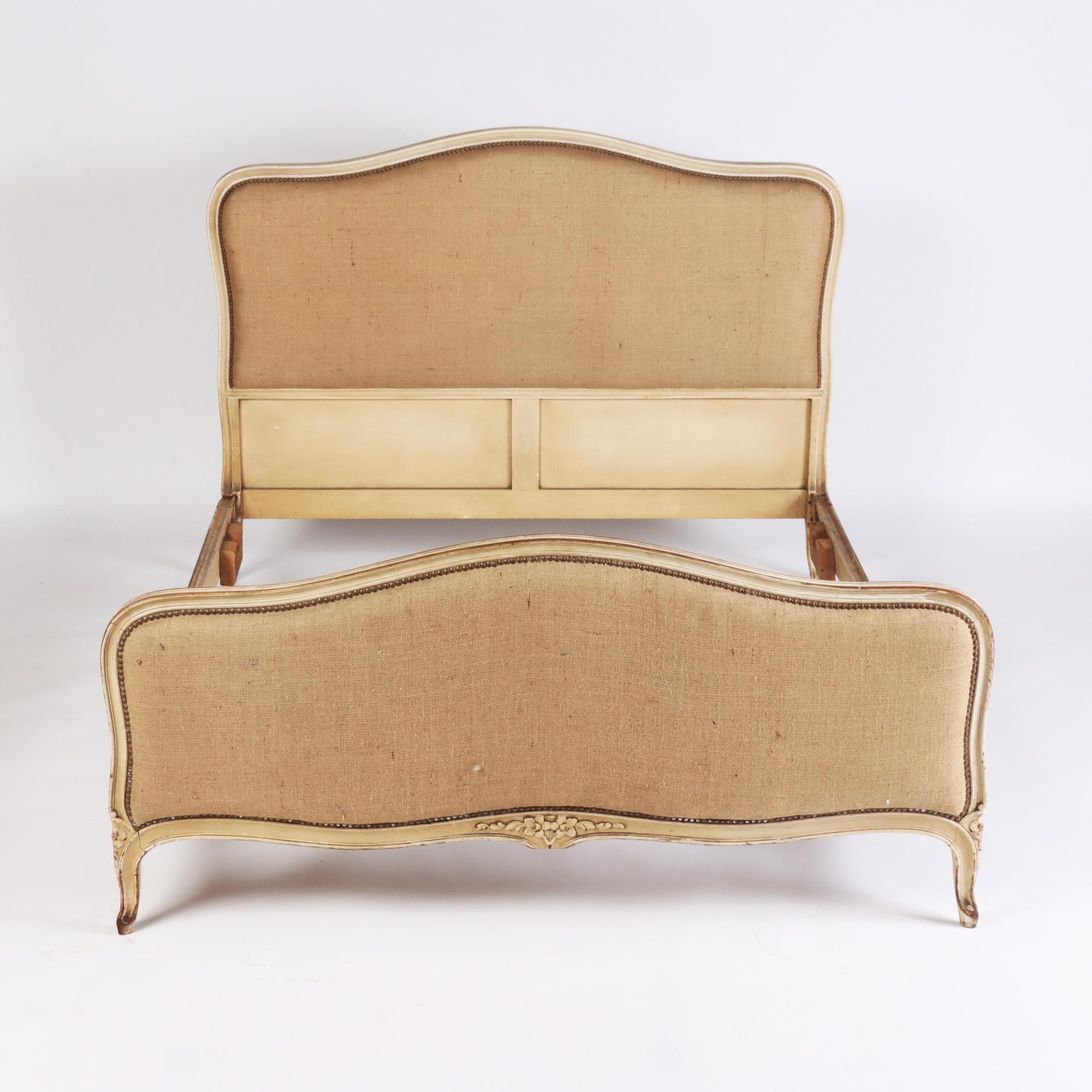 A French Louis XV style nearly Queen size painted bed with burlap upholstery. Circa 1920.
 Interior: 79