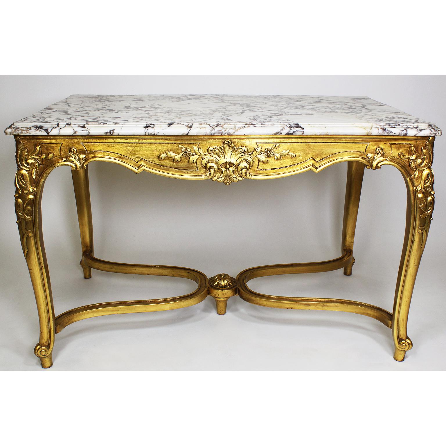 A French Early 20th Century Louis XV Style Gilt Wood Carved Center Table with Veined White Marble Top. Circa: Paris, 1920.

Height: 30 1/2 inches (77.5 cm)
Width: 48 inches (121.9 cm)
Depth: 30 3/8 inches (77.2 cm)

Ref.: A811