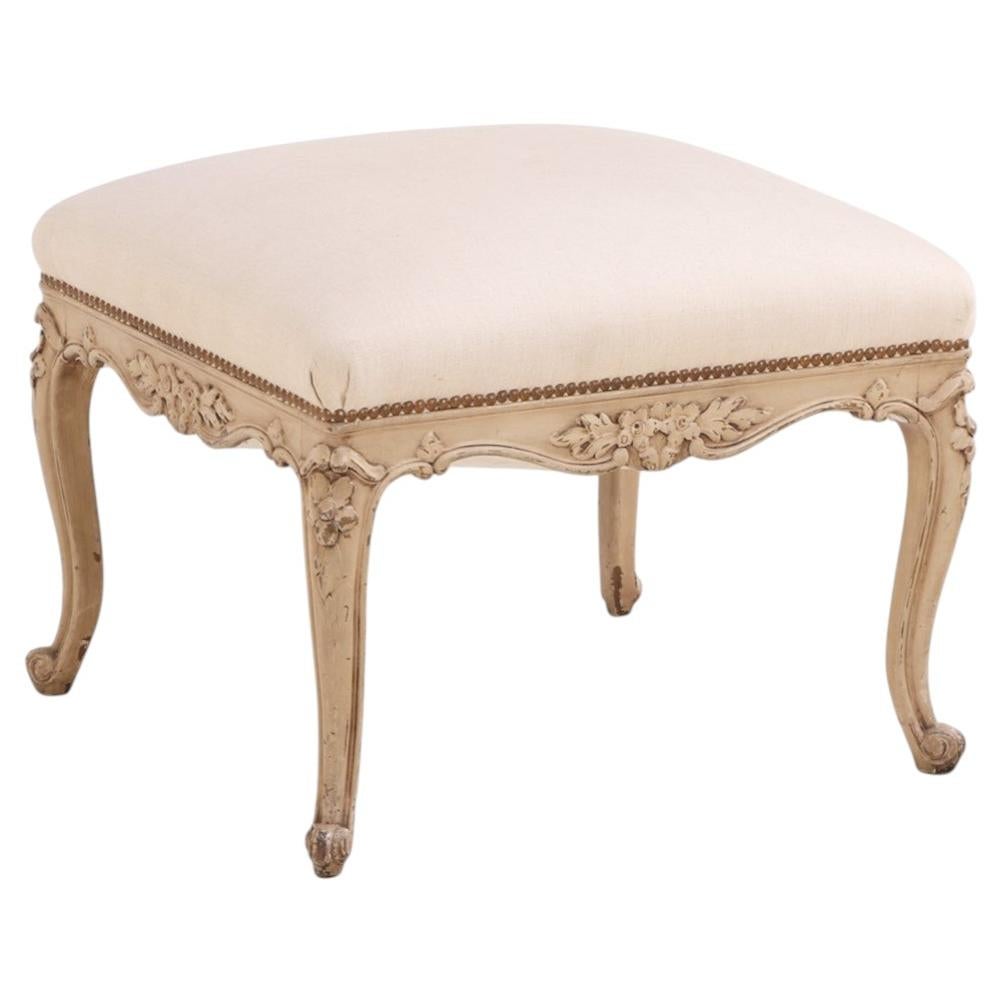 A French Louis XV style painted and carved wood upholstered stool, C. 1900.