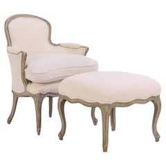 A French Louis XV style painted armchair and matching stool, C. 1910.