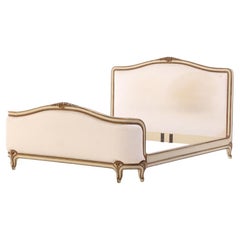 A French Louis XV style Queen size painted and carved bed, circa 1940.