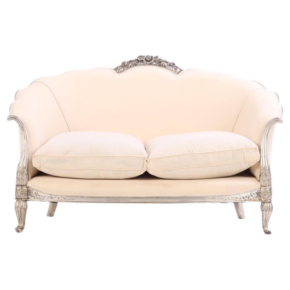 A French Louis XV style silver leaf carved settee, C. 1930. For Sale