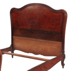A French Louis XV style walnut and burl walnut full size bed, C. 1900.