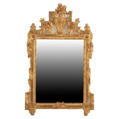 A French Louis XVI style carved and giltwood mirror, early to mid 19th C.