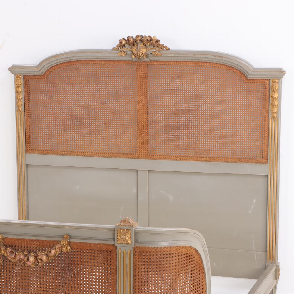 A French Louis XVI style carved, painted and giltwood full size bed, C 1900. In Good Condition In Philadelphia, PA