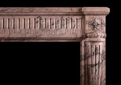 A French Louis XVI style fireplace mantel in Sarrancolin marble