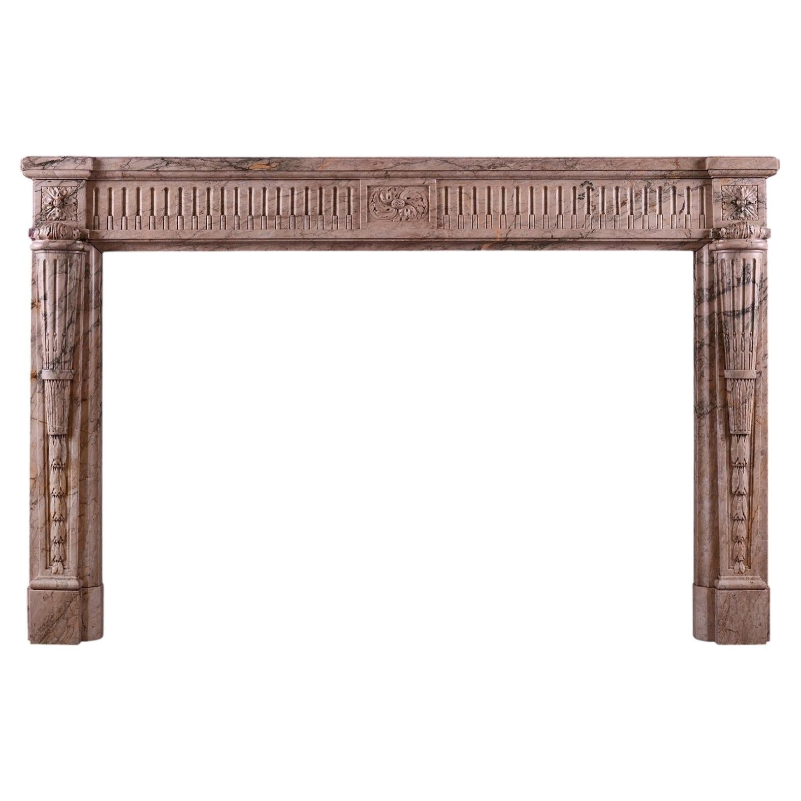 A French Louis XVI style fireplace mantel in Sarrancolin marble