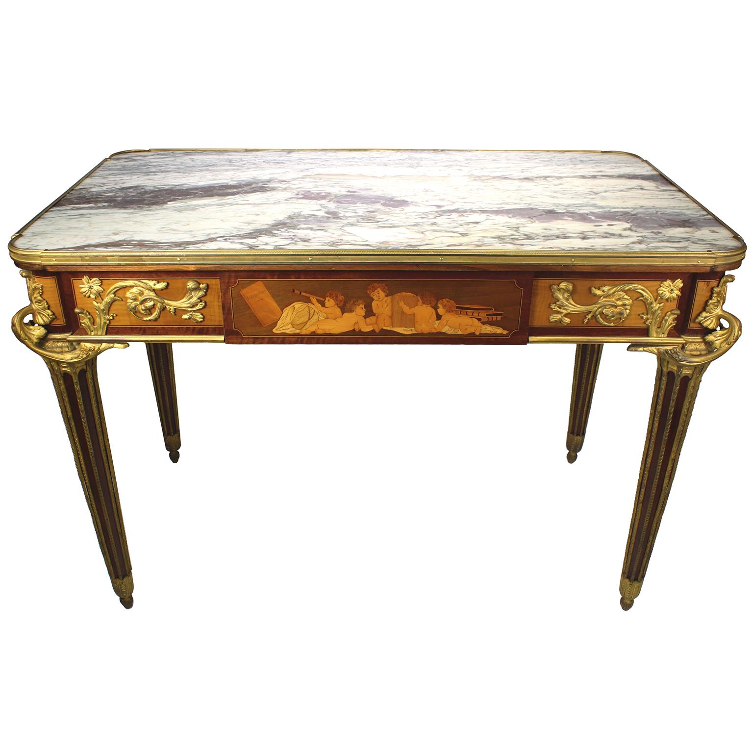 A Very Fine French 19th century Louis XVI Style Ormolu-Mounted Kingwood and Bois Citronnier Marquetry center table or writing table, attributed to François Linke (1855-1946), after the model by Jean-Henri Riesener (French, 1734-1806). The