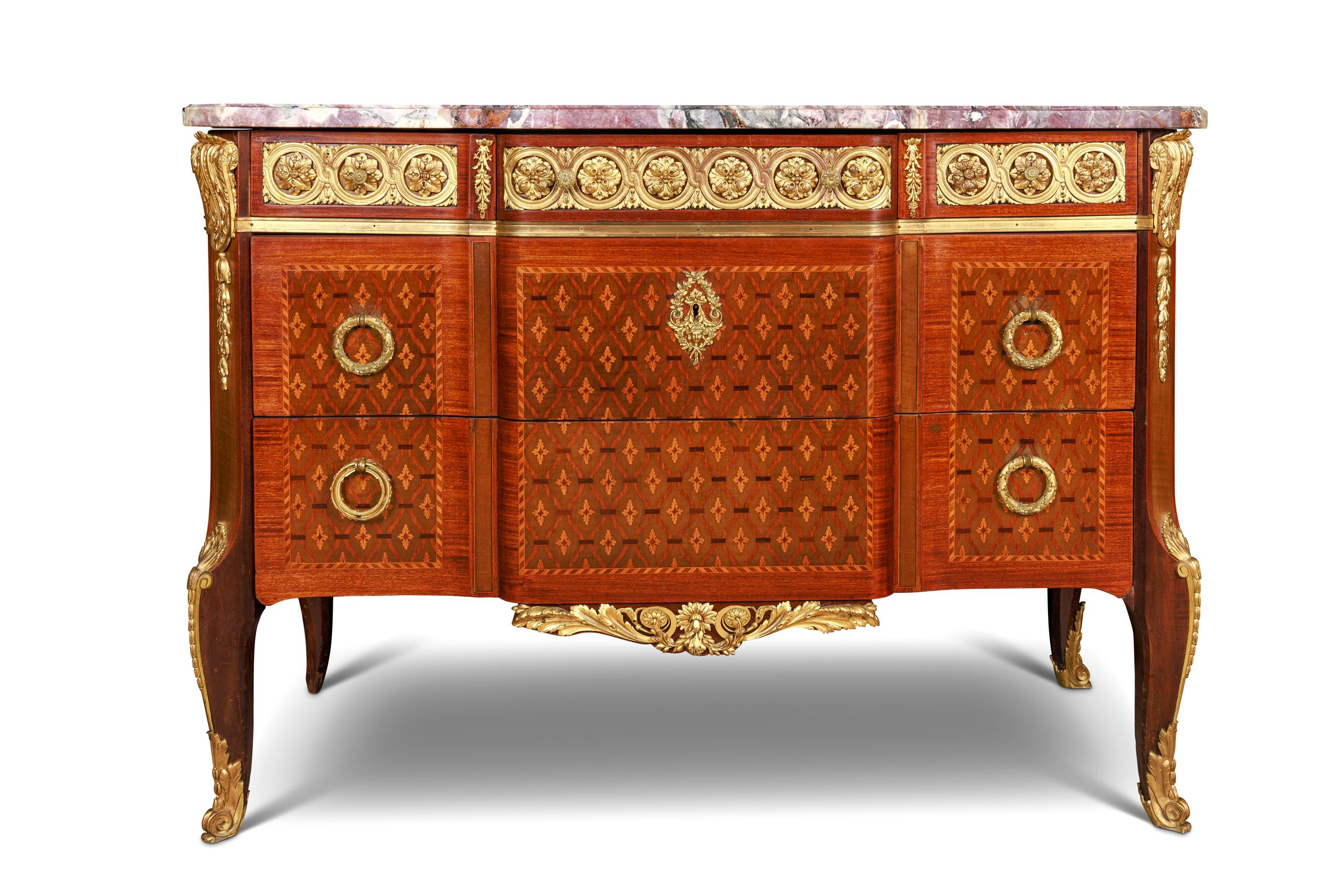 A French Louis XVI Style Ormolu-mounted marquetry and parquetry commode, circa 1875.

A very fine French 19th century finely chased ormolu-mounted kingwood, tulipwood, and satinwood marquetry and parquetry commode with original Breche Violette