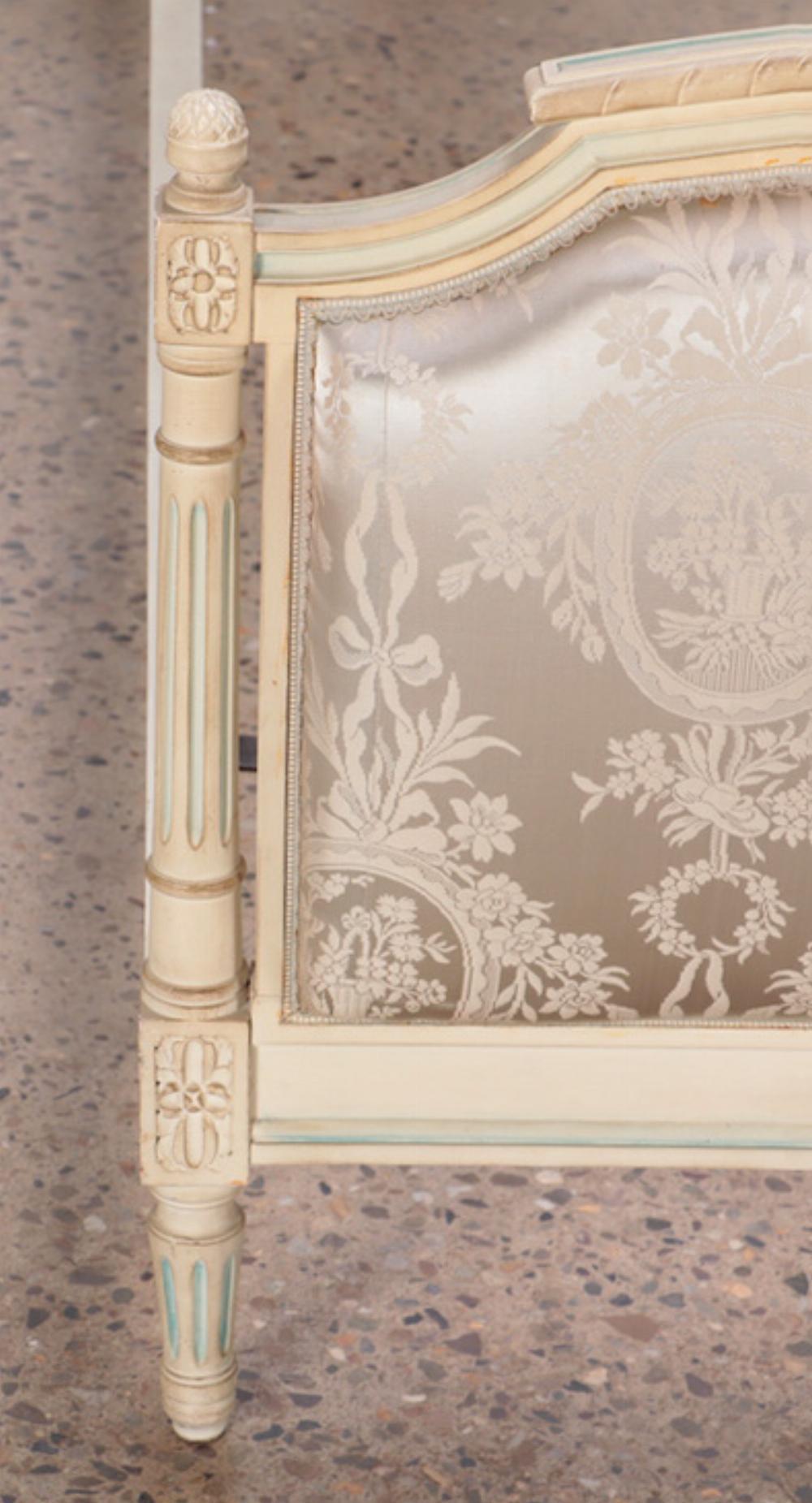 A French Louis XVI style painted and upholstered full size bed C 1940. In Good Condition In Philadelphia, PA