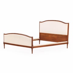A French Louis XVI style Walnut Full Size Bed, C. 1930.