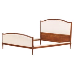 A French Louis XVI style Walnut Full Size Bed, C. 1930.