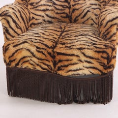 A French Lounge Chair covered in faux tiger fabric, 19th C..