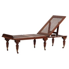 Antique A French mahogany and cane adjustable chaise lounge / campaign bed, 19th century