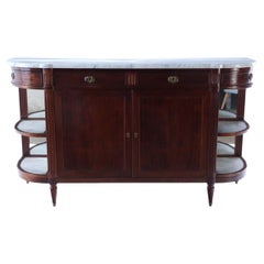 Antique A French mahogany sideboard circa 1920 having a white marble top with open sides