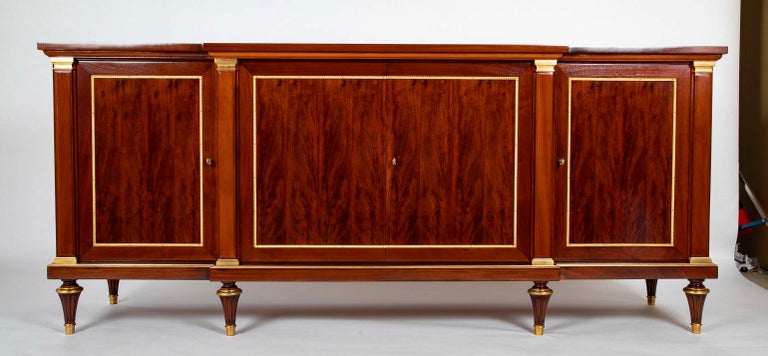 A French Mahogany & Speckled Mahogany Veneered Sideboard by Maurice Rinck A French Mahogany & Speckled Mahogany Veneered Sideboard by Maurice Rinck