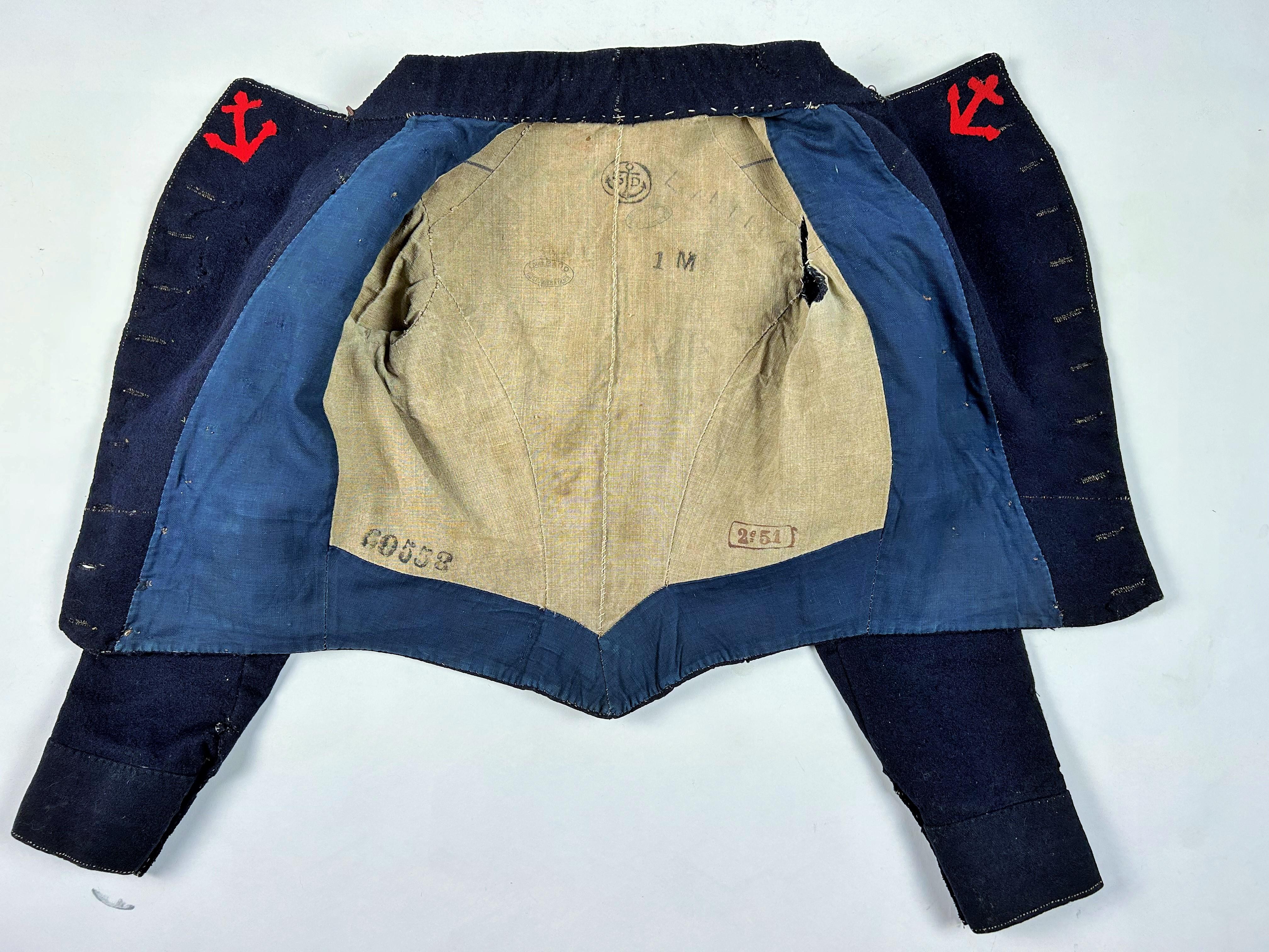 Circa 1851
France

A rare Troupe de Marin paletot jacket, model 1851, dating from the Monarchie de Juillet. Navy woollen cloth with eleven brass buttons engraved with a naval anchor and the inscription Equipage de ligne. The lapels are trimmed with