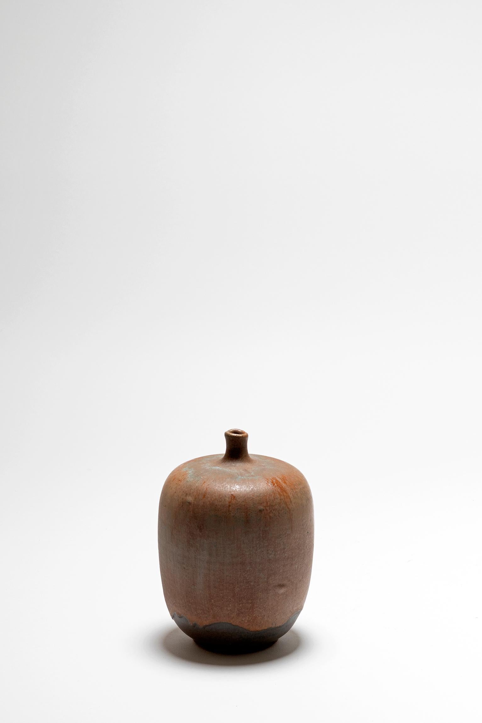 A polychrome ceramic thin neck vase
France, second half of the 20th century.