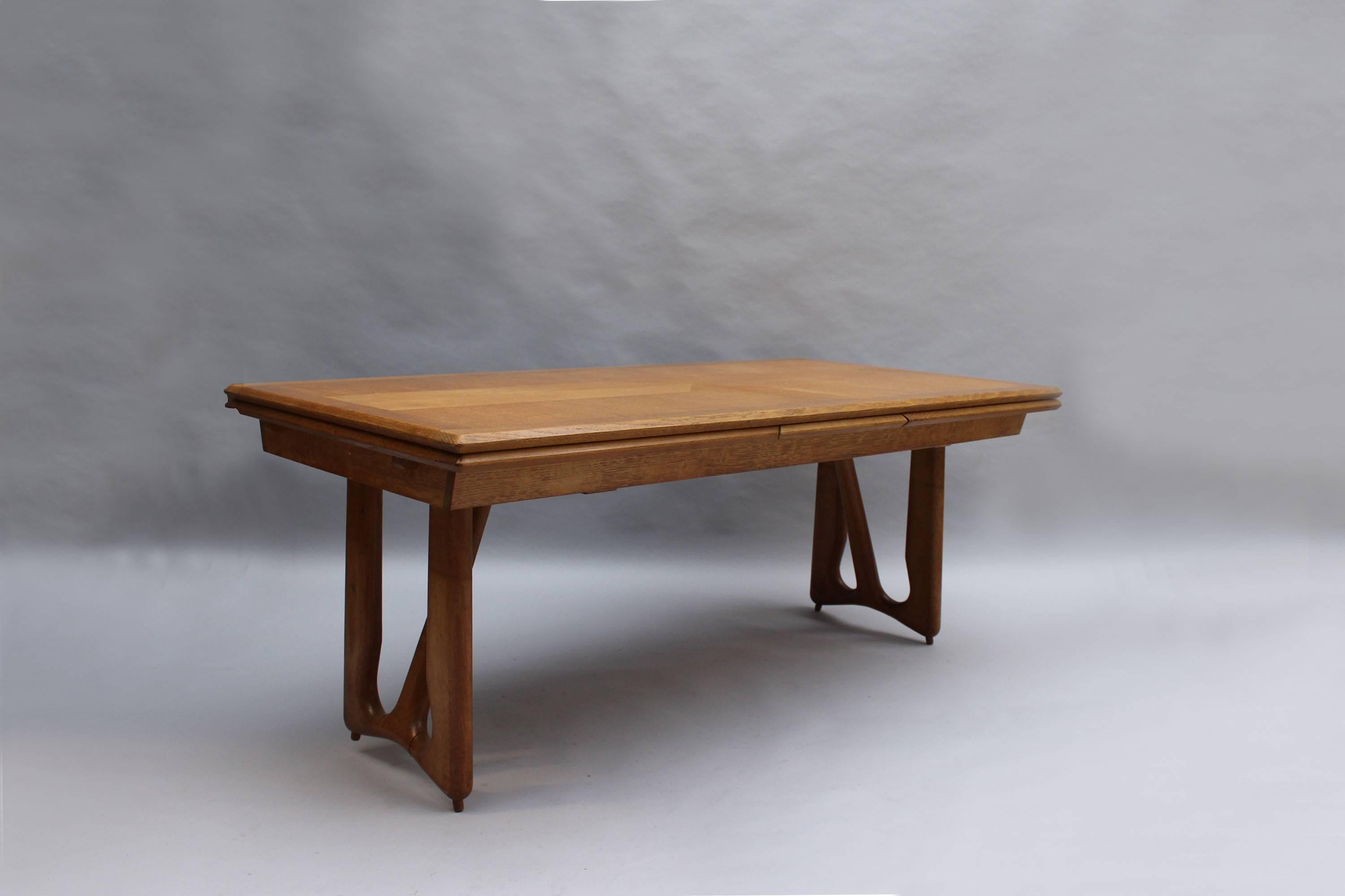 A large French 1960s oak table with two extension leaves 