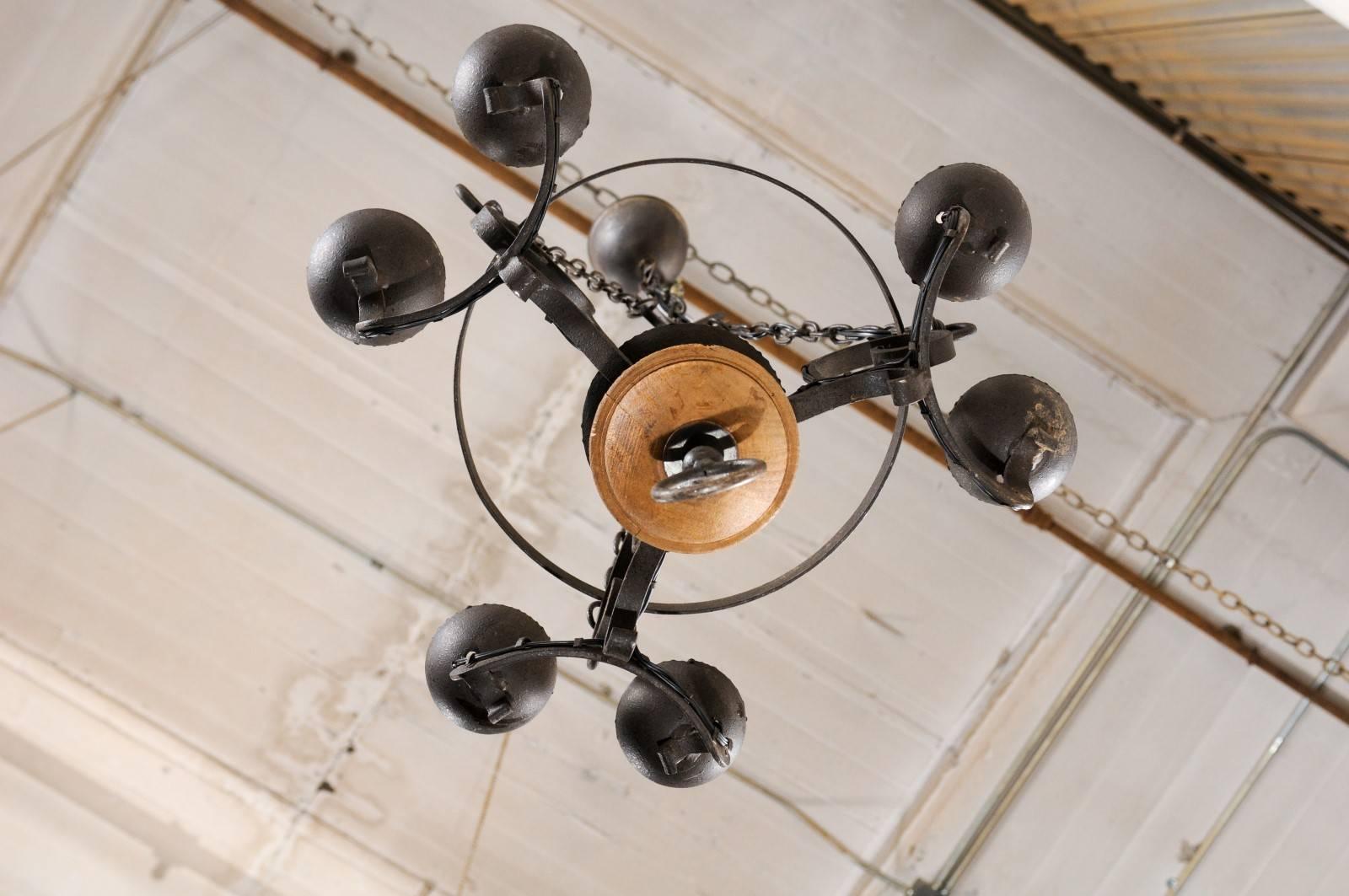 French Midcentury Forged Iron Chandelier with a Carved Wood Sphere Accent 1