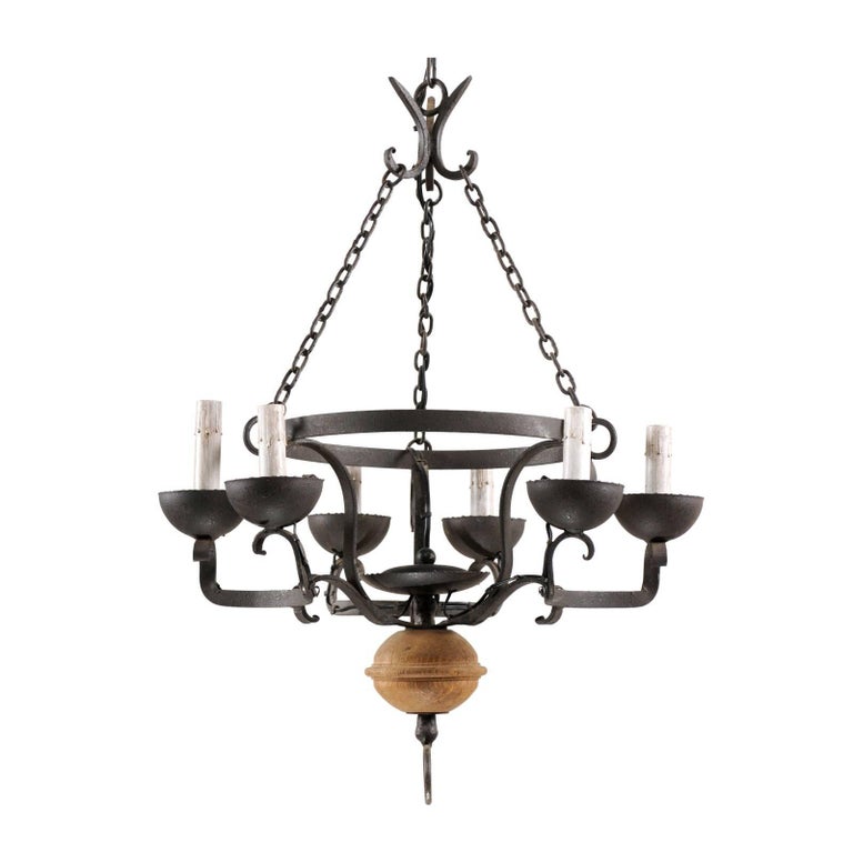 French Midcentury Forged Iron Chandelier With A Carved Wood Sphere French Midcentury Forged Iron Chandelier With A Carved Wood Sphere Accent For