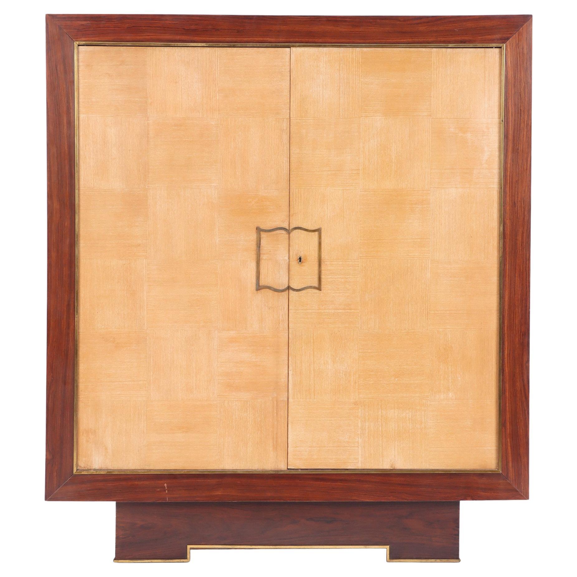 A two door cabinet designed by Jean Royere for Gouffe C 1935