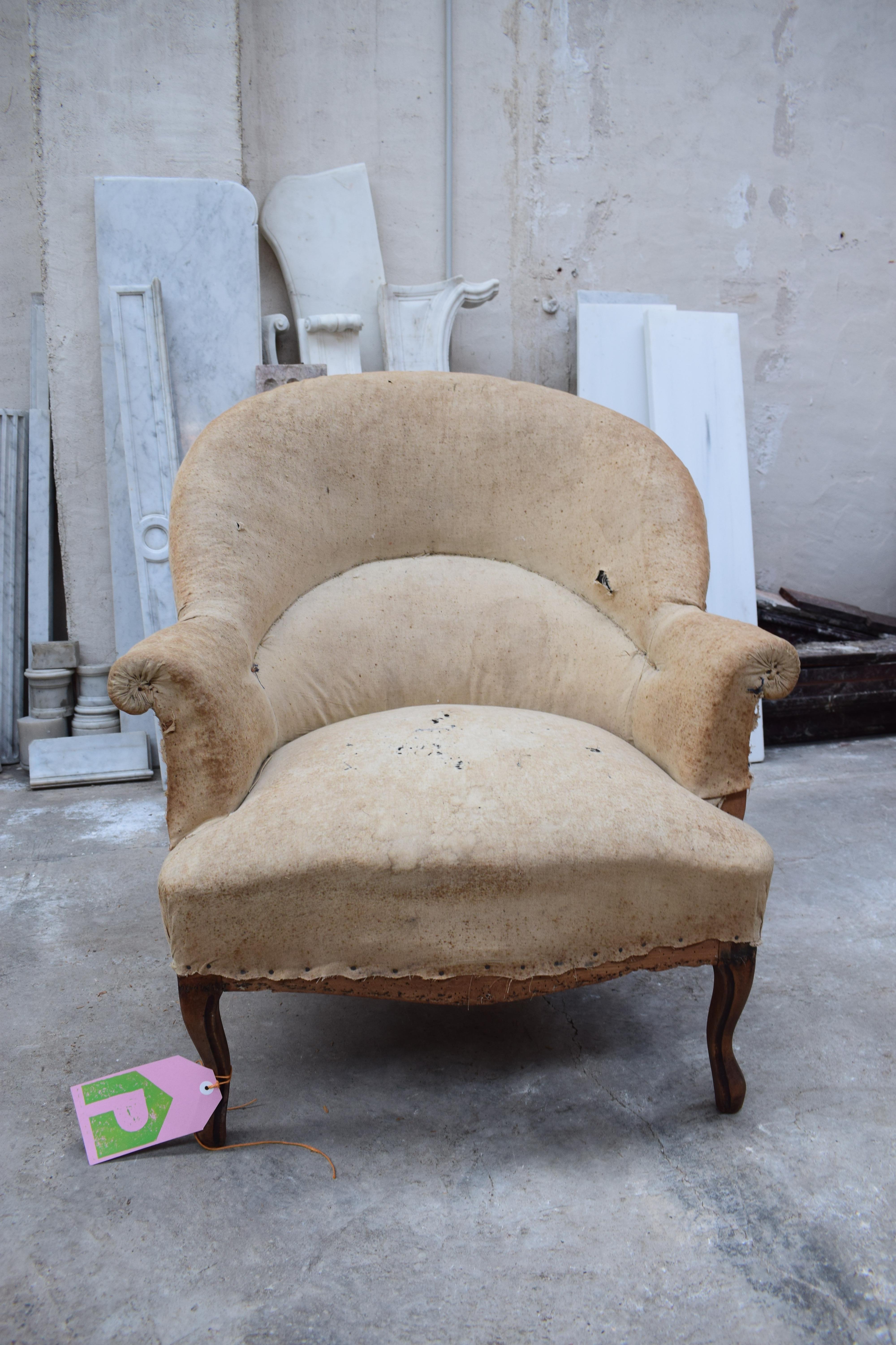 A French Napoleon III style tub chair dating from around 1850. This very comfortable chair is the typical style from the Napoleon III period. It has elegant cabriole legs. The high round back is a fabulous shape and has a great form. The tub chair