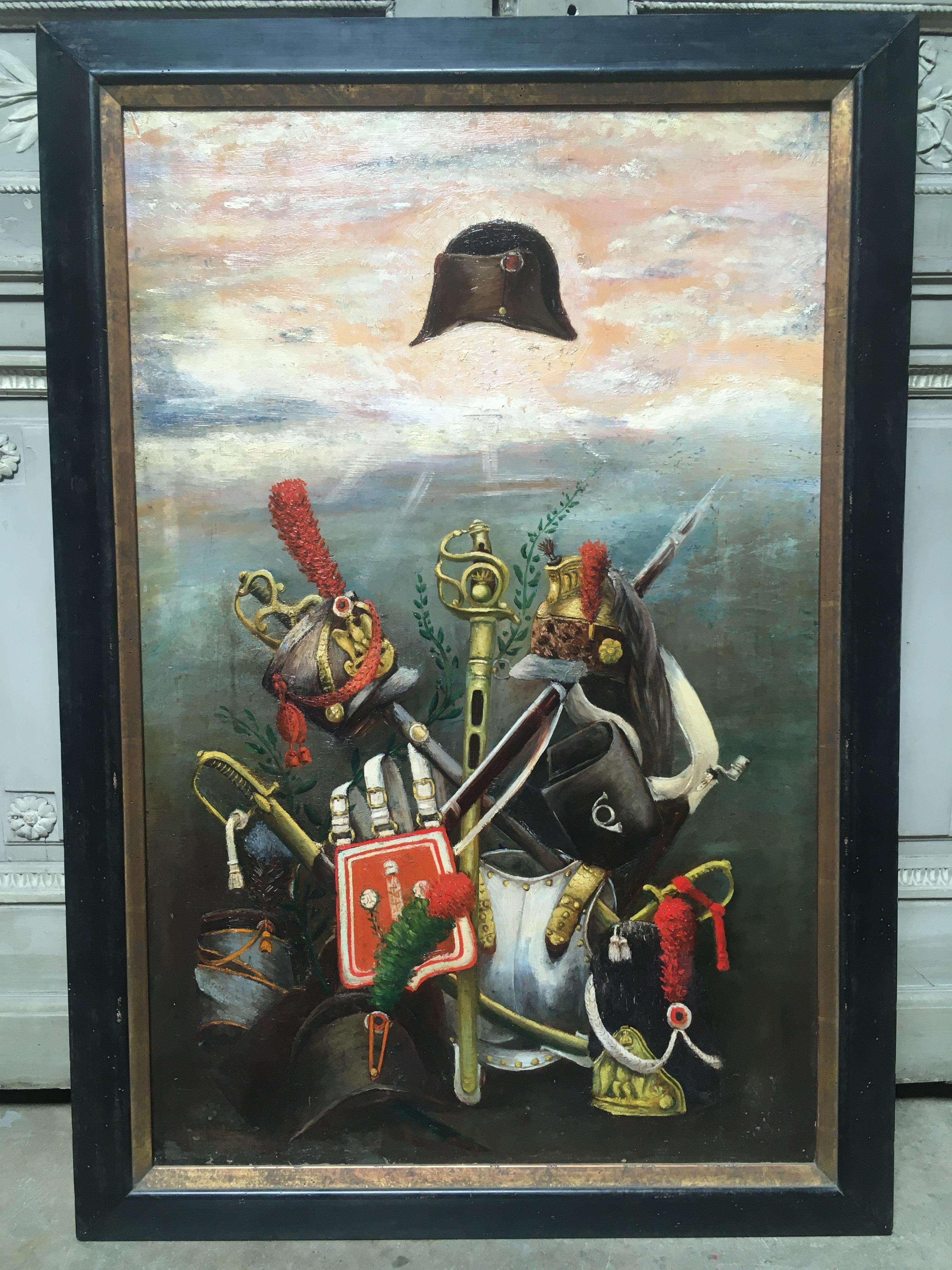 A French Empire Napoleonic military oil on canvas painting with a newer ebonized and gilded frame. The still life painting depicts French National pride during Napoleon times and military paraphernalia of the Empire era. 