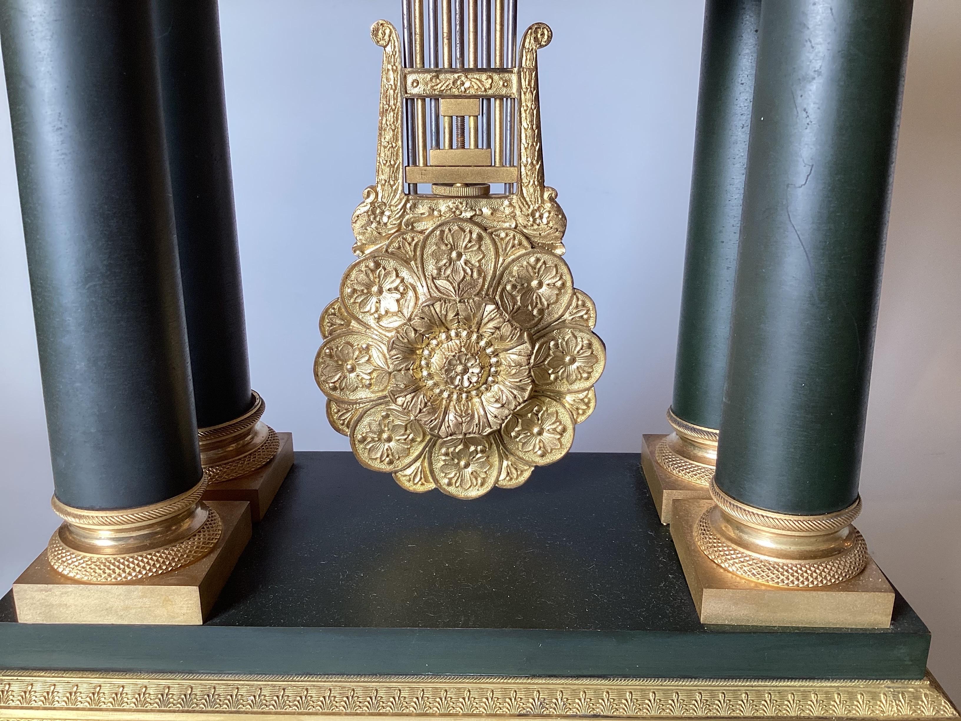 A French Neoclassical Style Gilt and Patinated Bronze Portico Clock Circa 1875 In Good Condition For Sale In Lambertville, NJ