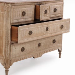 A French Neoclassical white washed and carved oak commode, C. 1850.