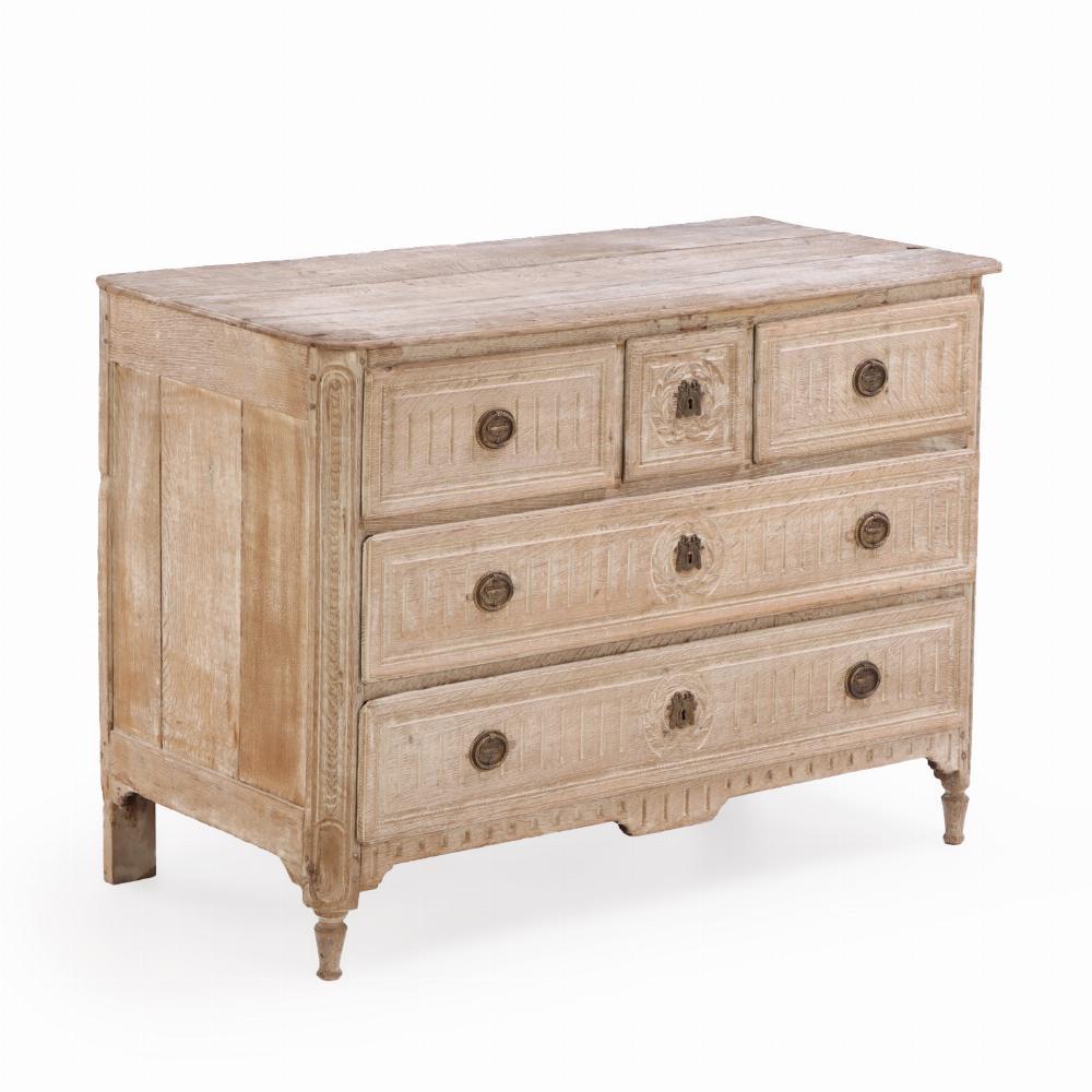 Oak A French Neoclassical white washed and carved oak commode, C. 1850.
