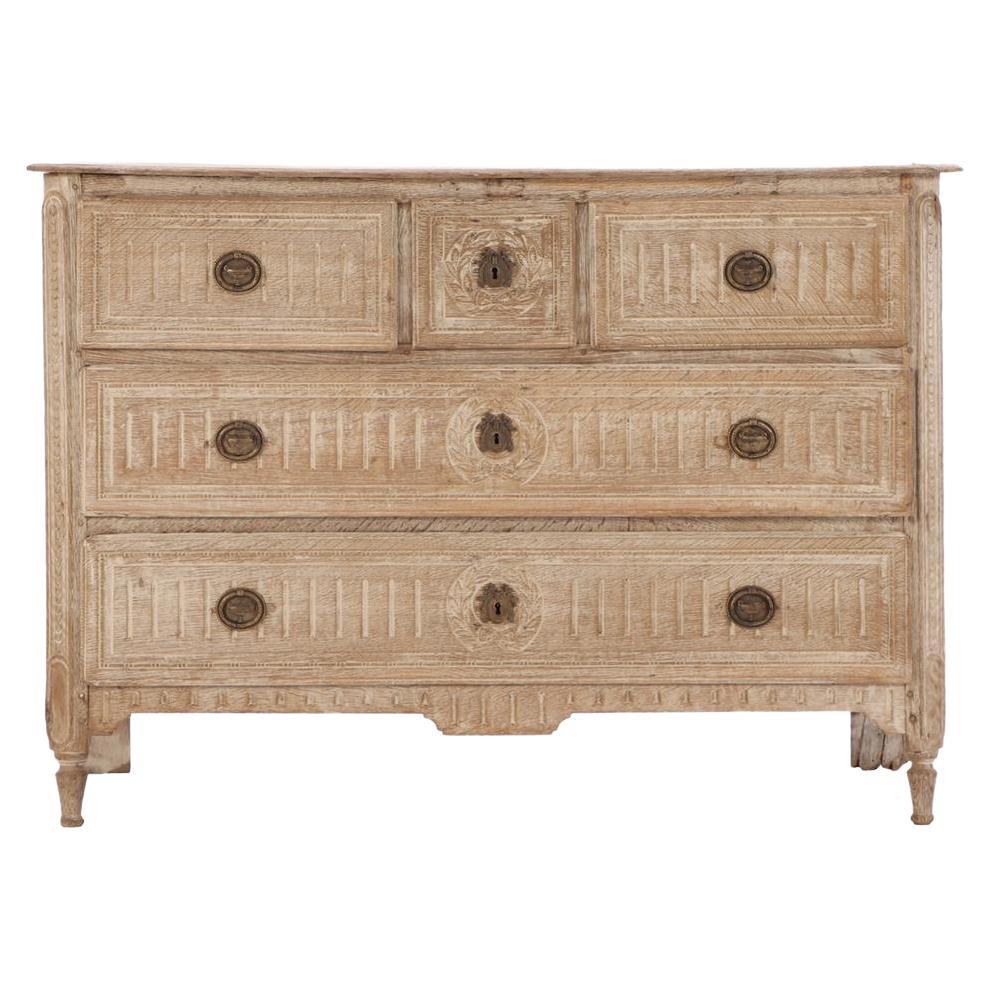 A French Neoclassical white washed and carved oak commode, C. 1850.