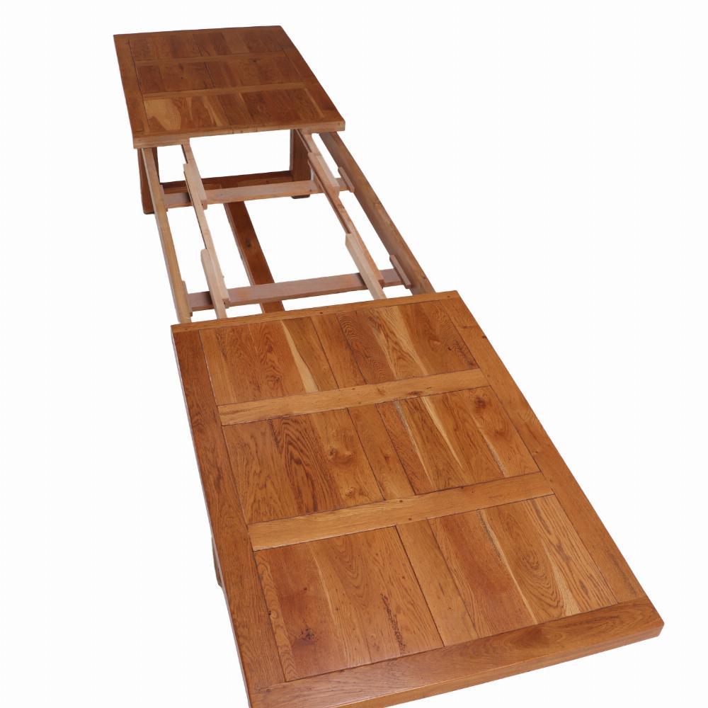 This is a huge farm table with 3 leaves! It is This warm oak H-stretcher table will grow with your family or your events. With a thick top sitting on a base with sturdy square chamfered legs united by end and center stretchers, it is ready to serve