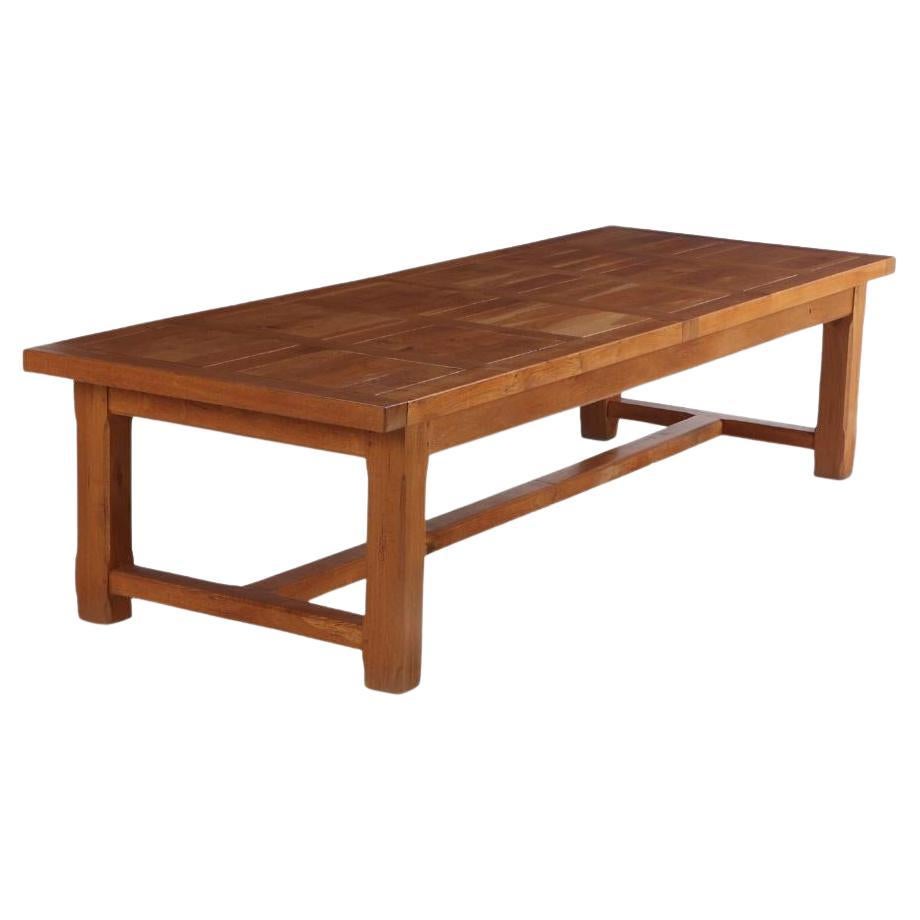 A French oak farm table, of unusually large size, C. 1970. For Sale