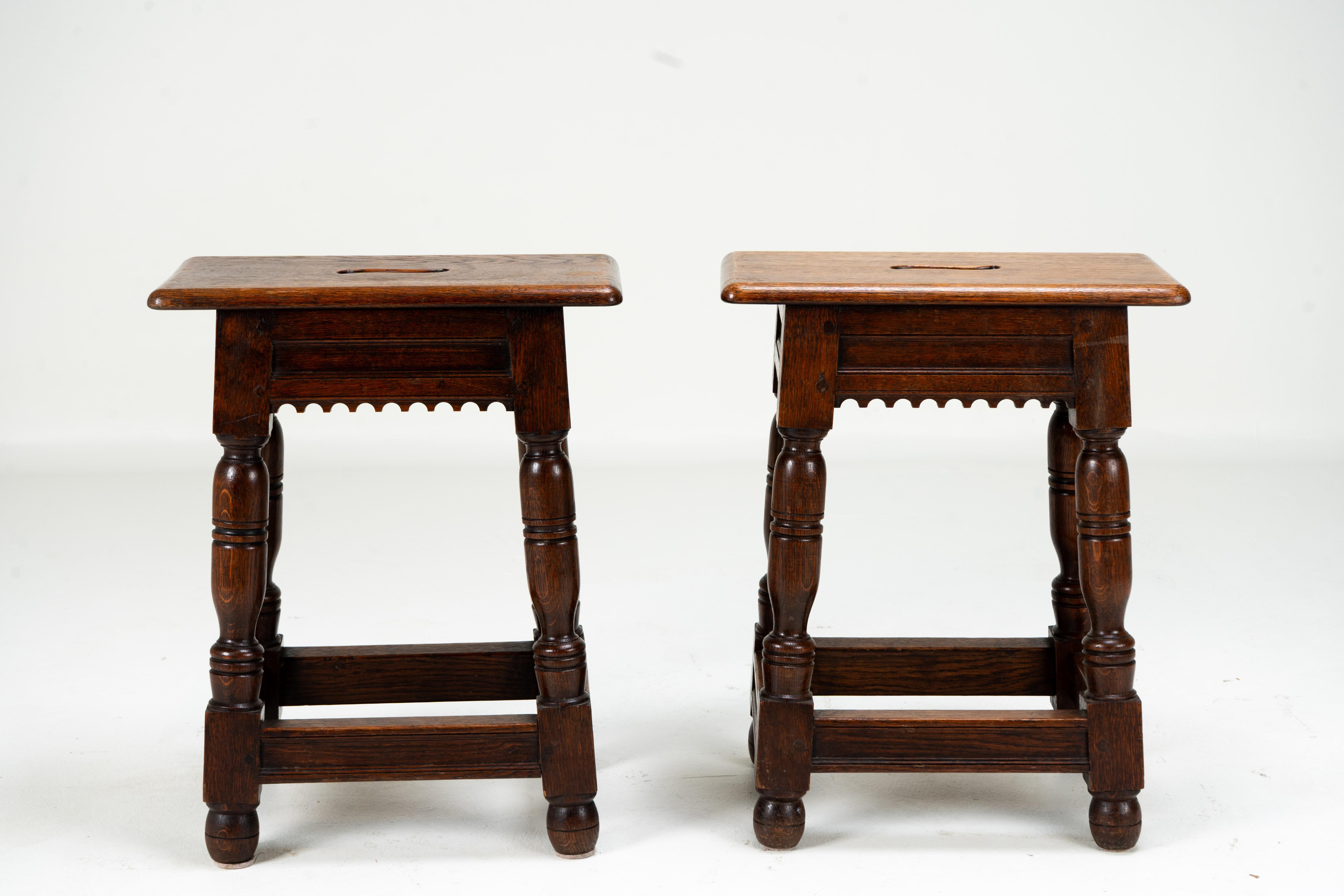 This French joint stool is made from oak. The construction is pegged. The top follows down to a lovely hand-carved decorated apron, and the stool is supported on splayed and hand-turned legs, joined by simple stretchers.