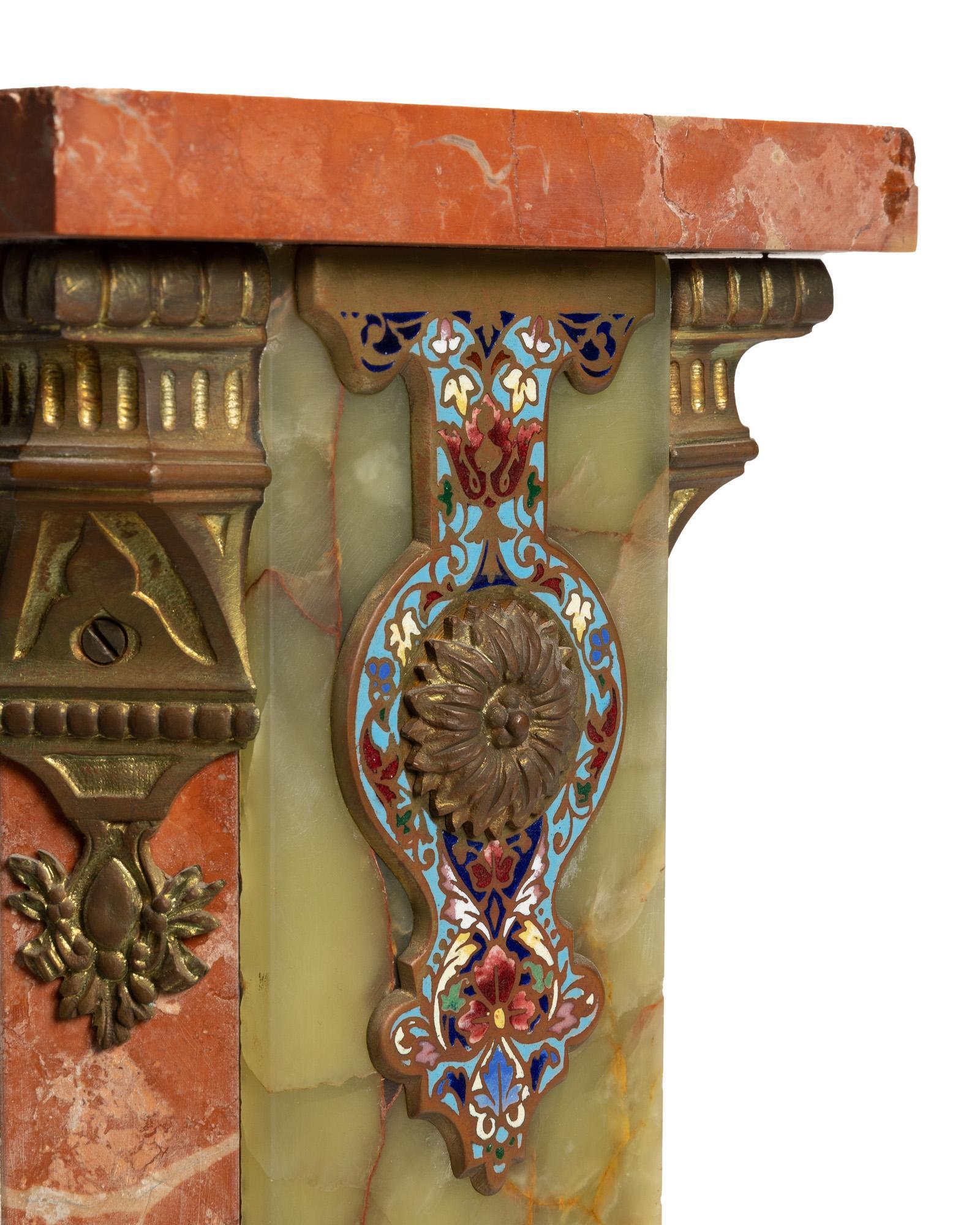 A French onyx and champlevé enamel pedestal 1