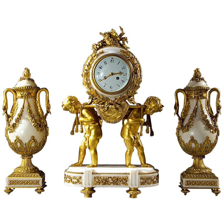 French Ormolu and White Marble Three-Piece Clock Set