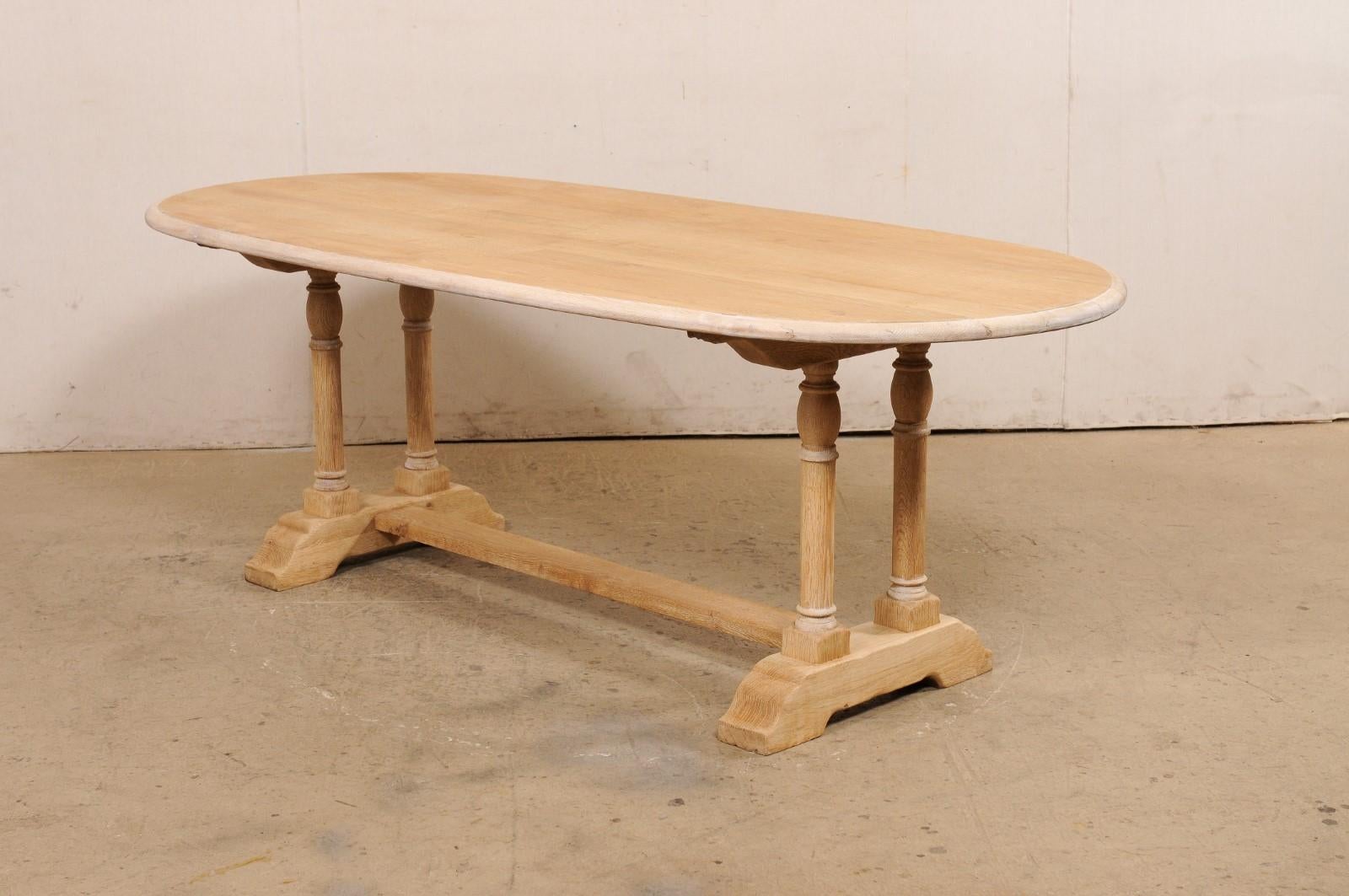 A French Oval-Shaped Bleached Wood Trestle Dining Table, Mid 20th Century For Sale 7