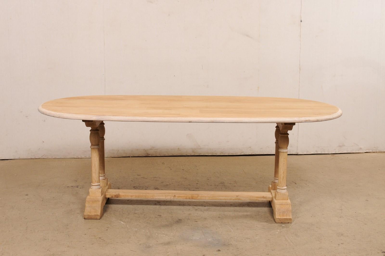 A French Oval-Shaped Bleached Wood Trestle Dining Table, Mid 20th Century For Sale 6