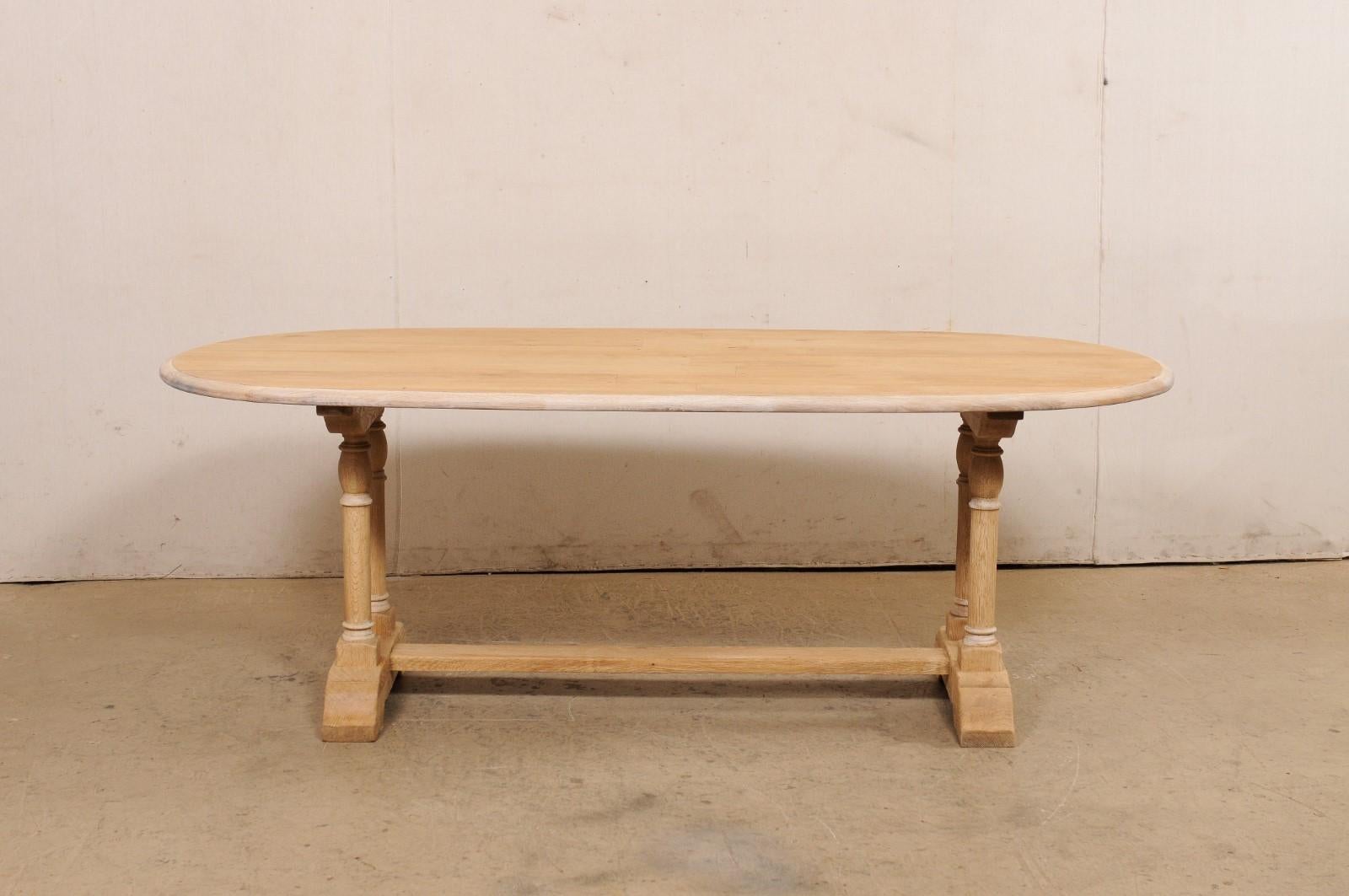 A French Oval-Shaped Bleached Wood Trestle Dining Table, Mid 20th Century For Sale 1