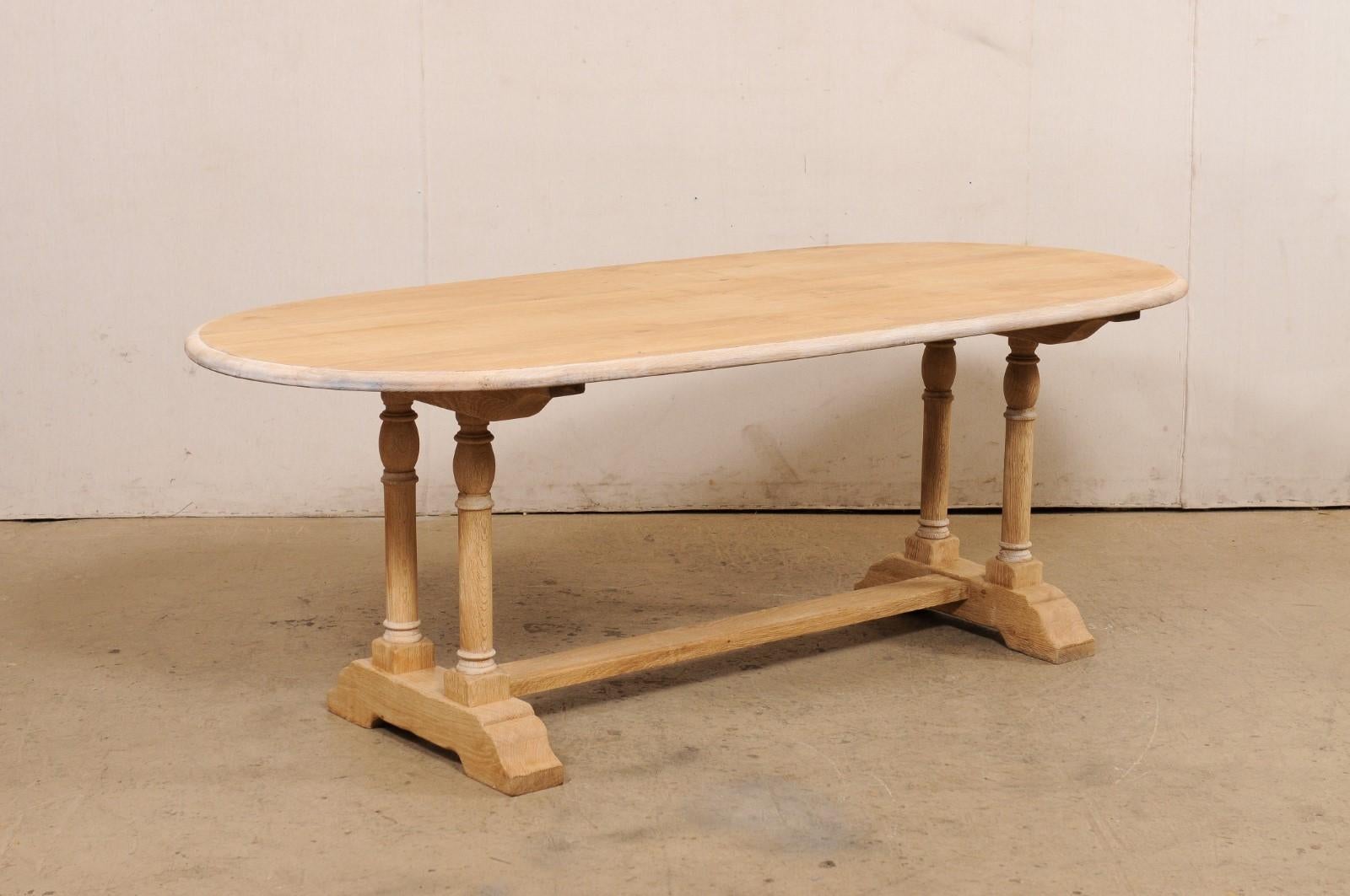 A French Oval-Shaped Bleached Wood Trestle Dining Table, Mid 20th Century For Sale 4