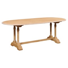 A French Oval-Shaped Bleached Wood Trestle Dining Table, Mid 20th Century