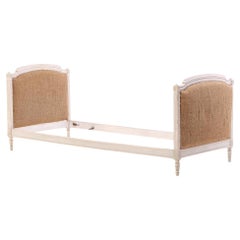 A French painted and carved daybed, C. 1900.