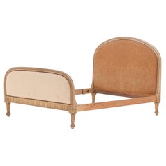 A French painted and carved full size bed, in the Regency style, C. 1900.