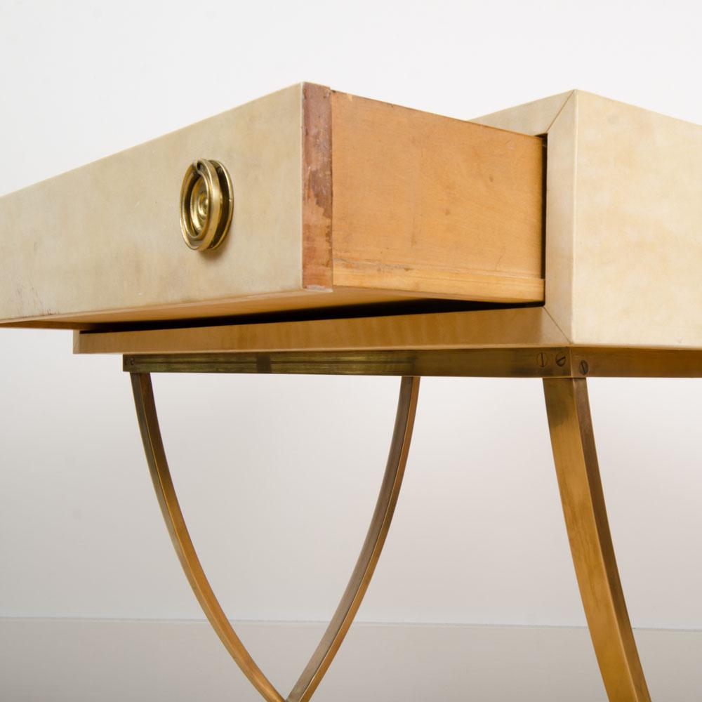 French parchment and bronze table having a single drawer in the manner of Andre Arbus, circa 1940.