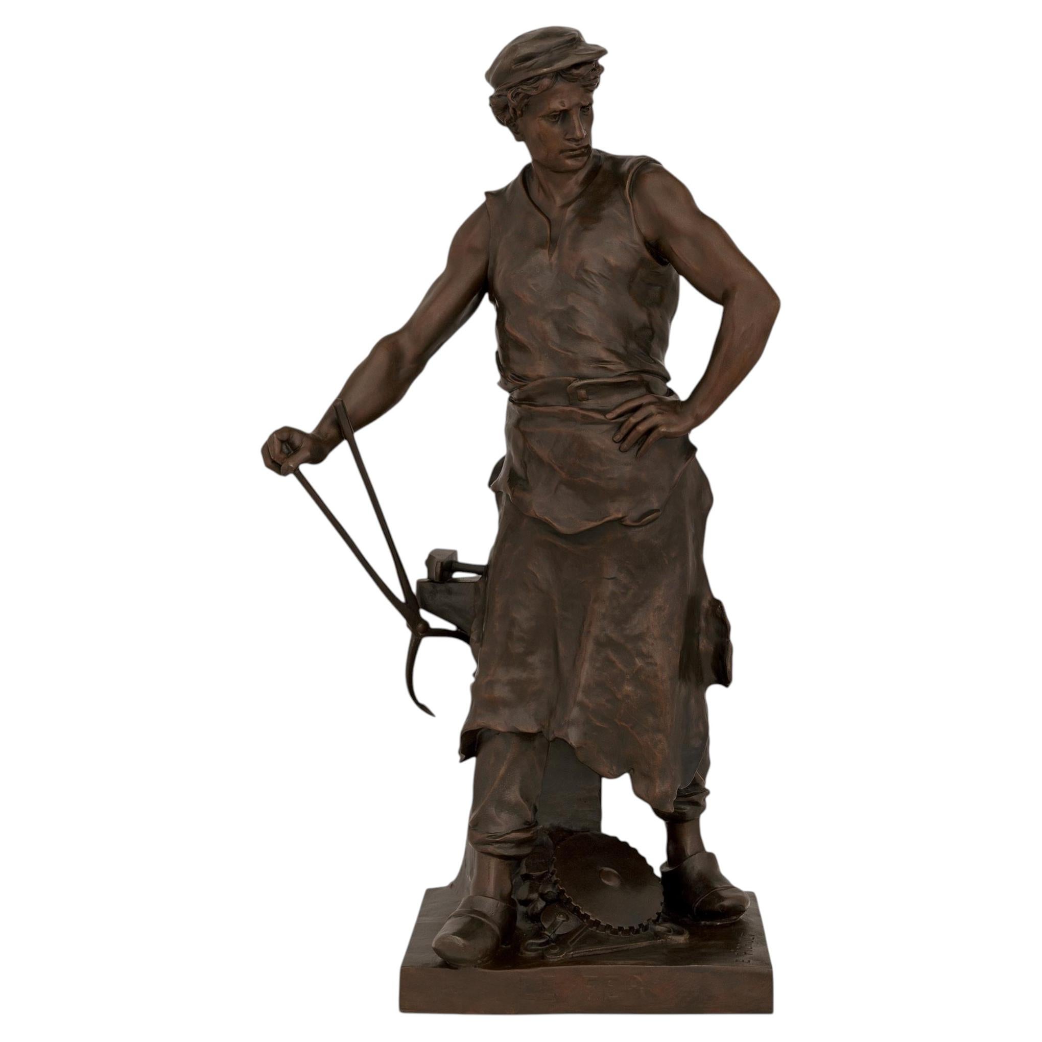 Eine französische, patinierte Bronzestatue eines Schmieds, signiert „Emile Louis Picault“