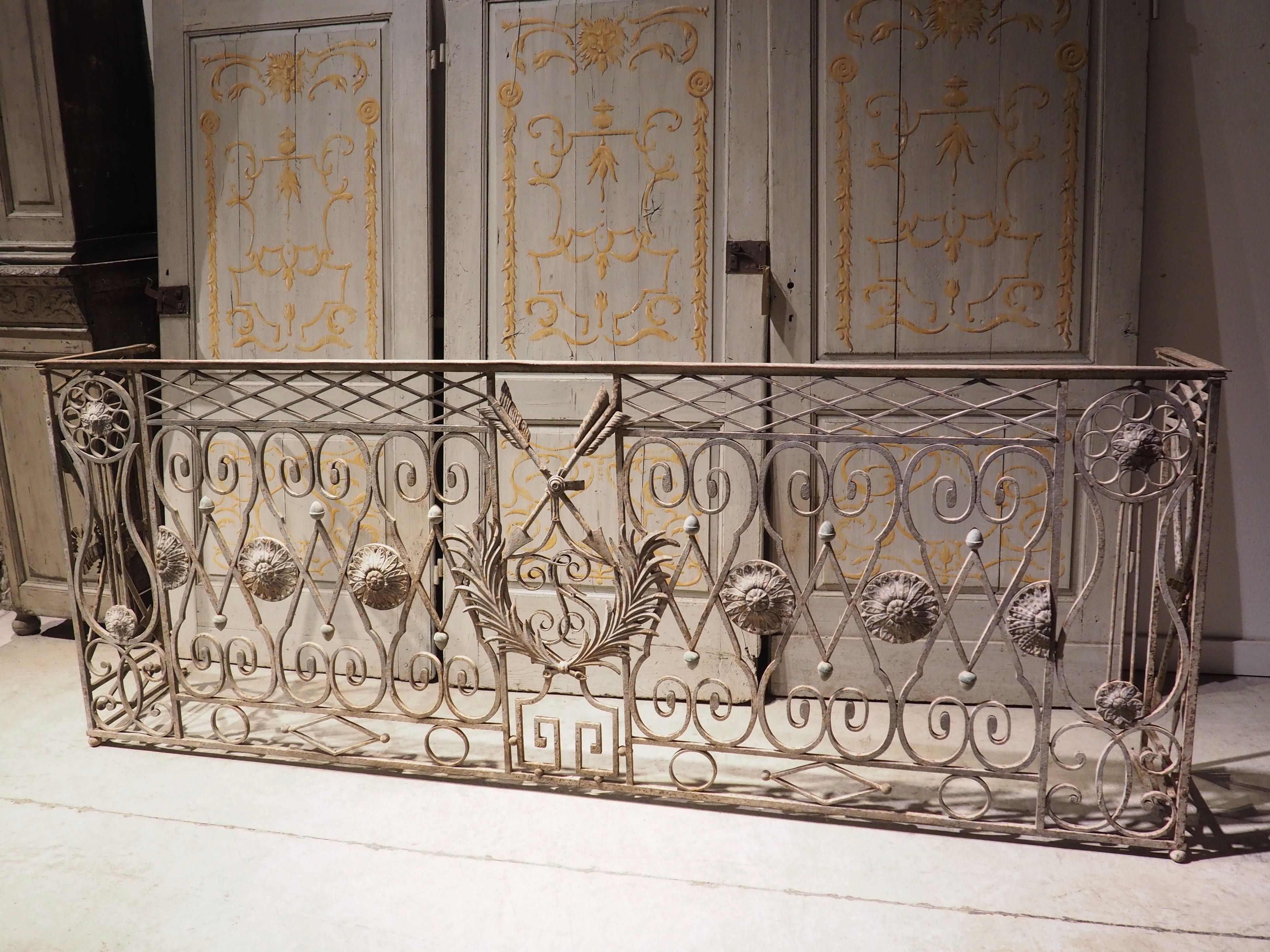 A beautiful example of period Louis XVI architecture, this French wrought iron balcony railing is from circa 1785, during a time when Neoclassical motifs were paramount. After the discoveries of Herculaneum and Pompeii (1709 and 1763, respectively),